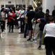Voters wait in line to vote early during midterm elections in Philadelphia on Nov. 7.